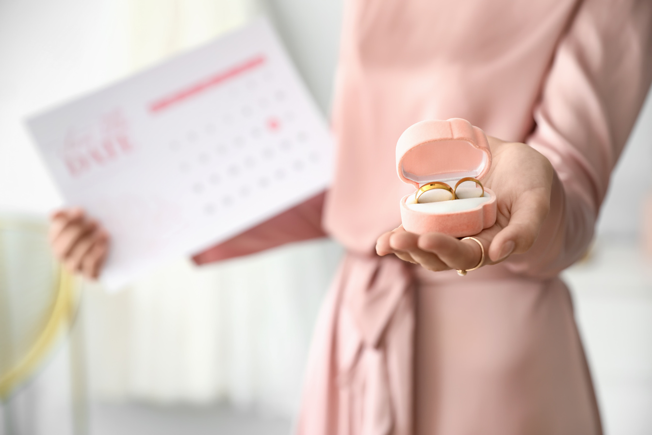 Female Wedding Planner with Rings in Office, Closeup